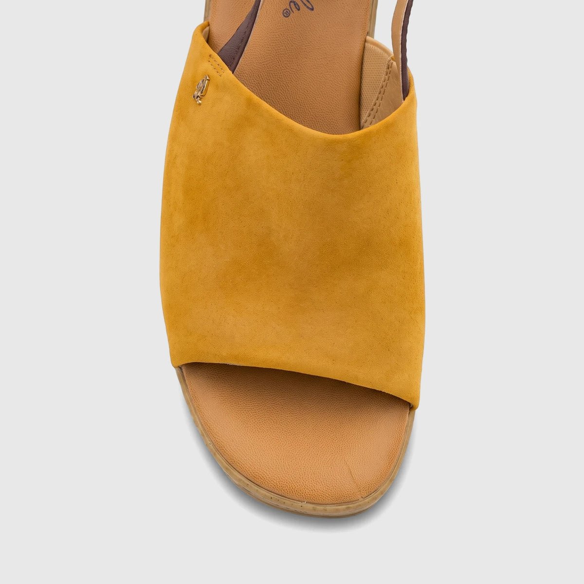 Close-up of a single Hush Puppies Soft Style Ladies Comfort Wedge Sandal Nobu in yellow suede, showcasing the open-toe