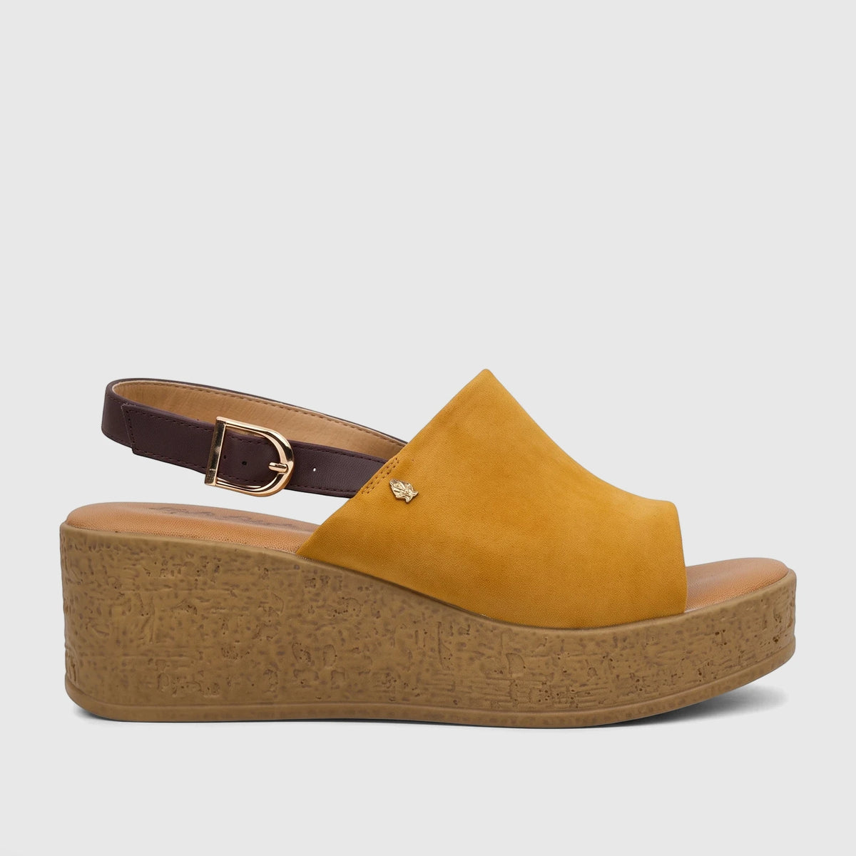Yellow suede Hush Puppies Soft Style Comfort Wedge Sandal with a dark brown strap and textured wedge sole.