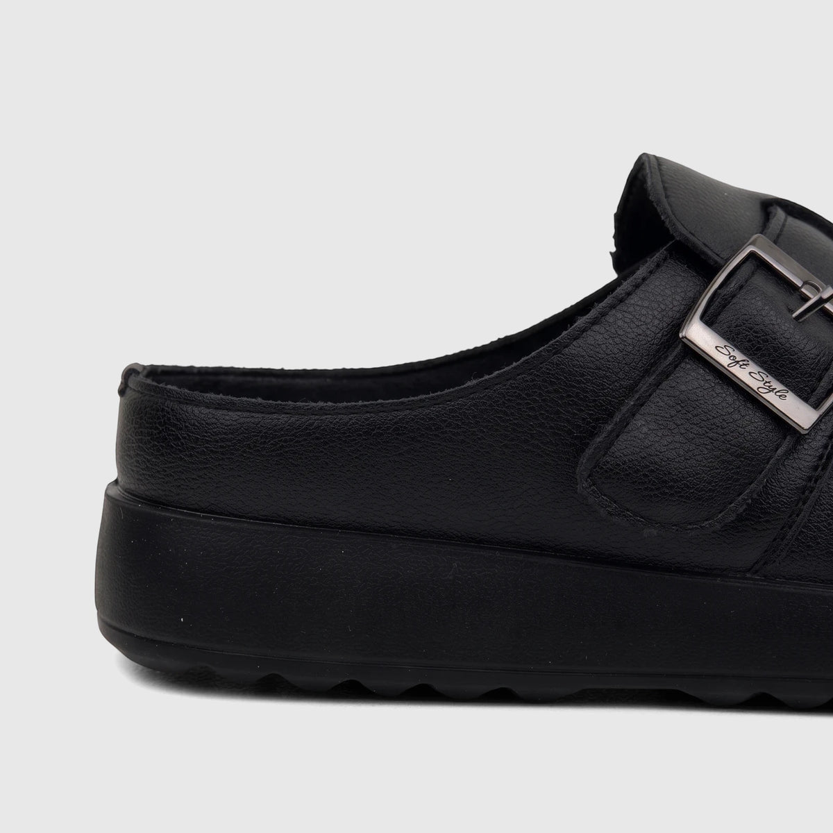 Black Hush Puppies Soft Style Noelle women's comfort clog with a silver buckle detail and platform sole, side view.