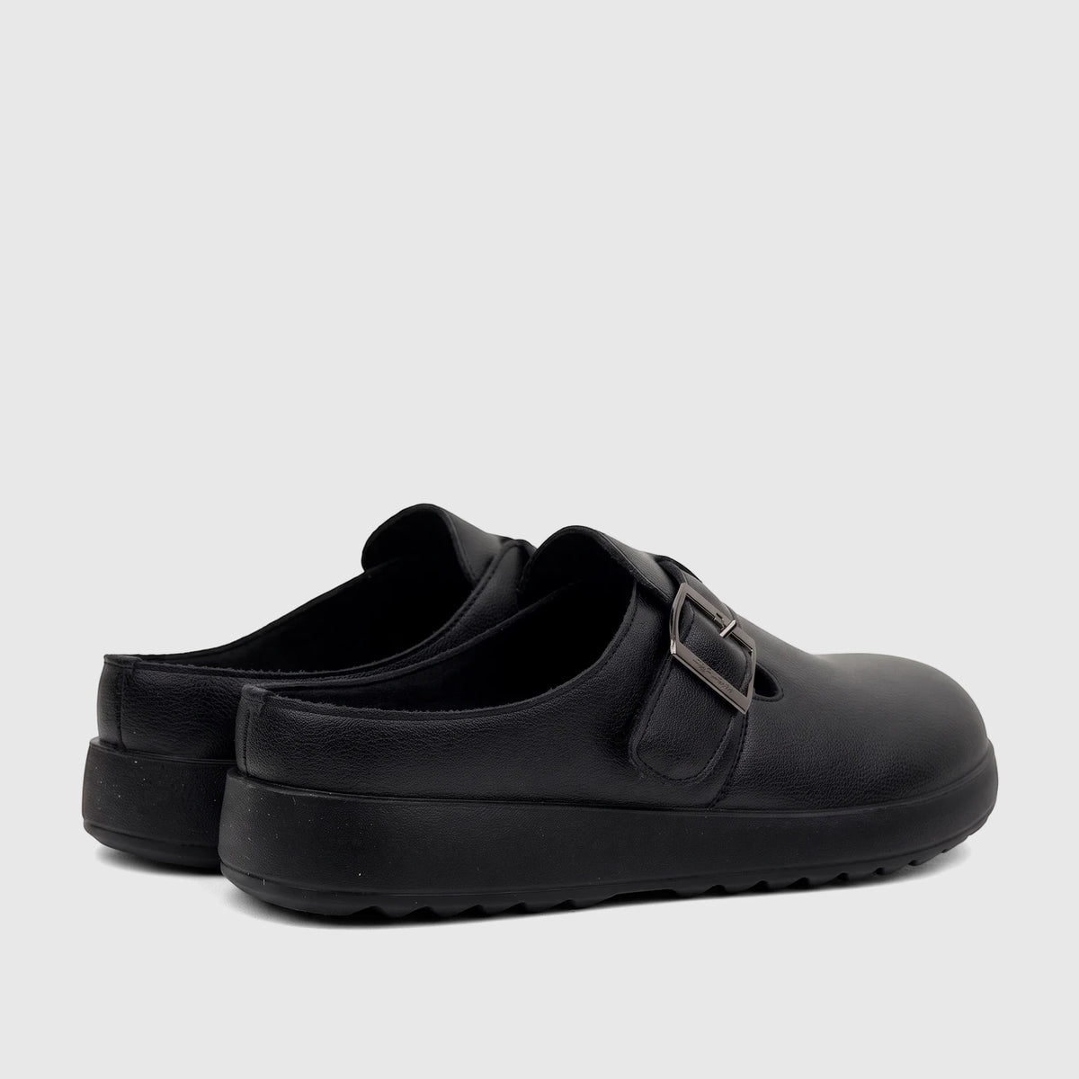 Black Hush Puppies Soft Style Noelle comfort clogs for ladies, featuring a buckle detail and a textured finish, viewed from