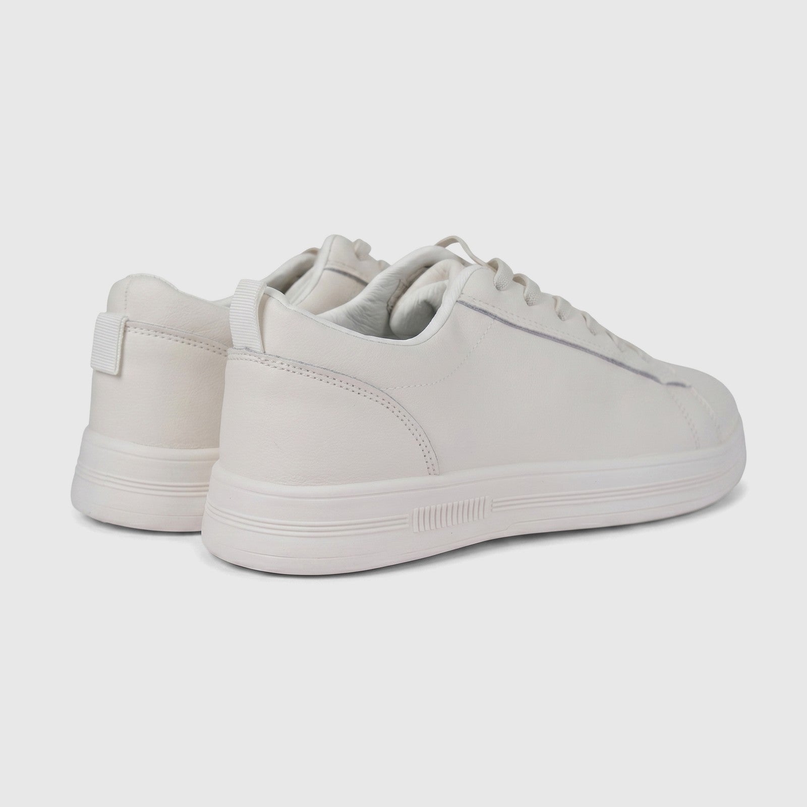 Hush Puppies Soft Style Tavaria ivory ladies comfort sneaker, lace-up low-top with smooth upper, side view.