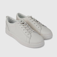Hush Puppies Soft Style Tavaria ladies comfort sneaker in ivory, lace-up low-top pair shown in side view.