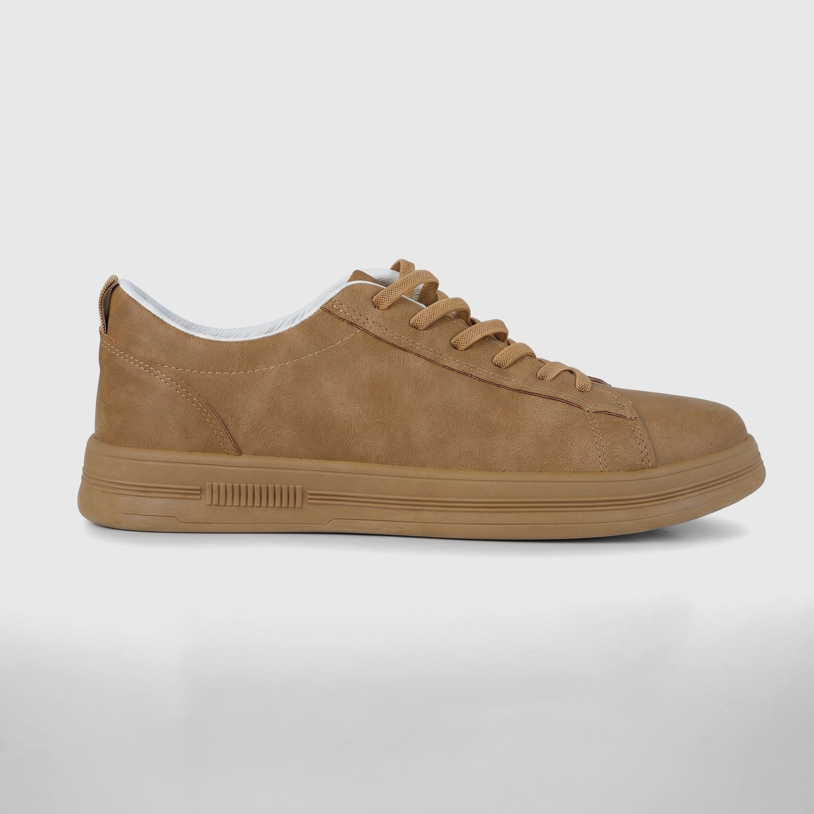 Hush Puppies Soft Style Tavaria ladies comfort sneaker in taupe nubuck, low-top lace-up, side view.