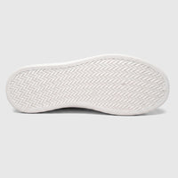 Hush Puppies Soft Style Tavaria ivory ladies comfort sneaker, bottom view showing white rubber outsole tread.