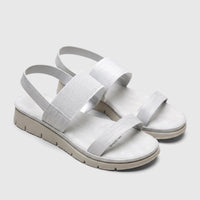 Pair of silver Hush Puppies Telina comfort sandals with textured straps and a light beige sole, angled view on a white