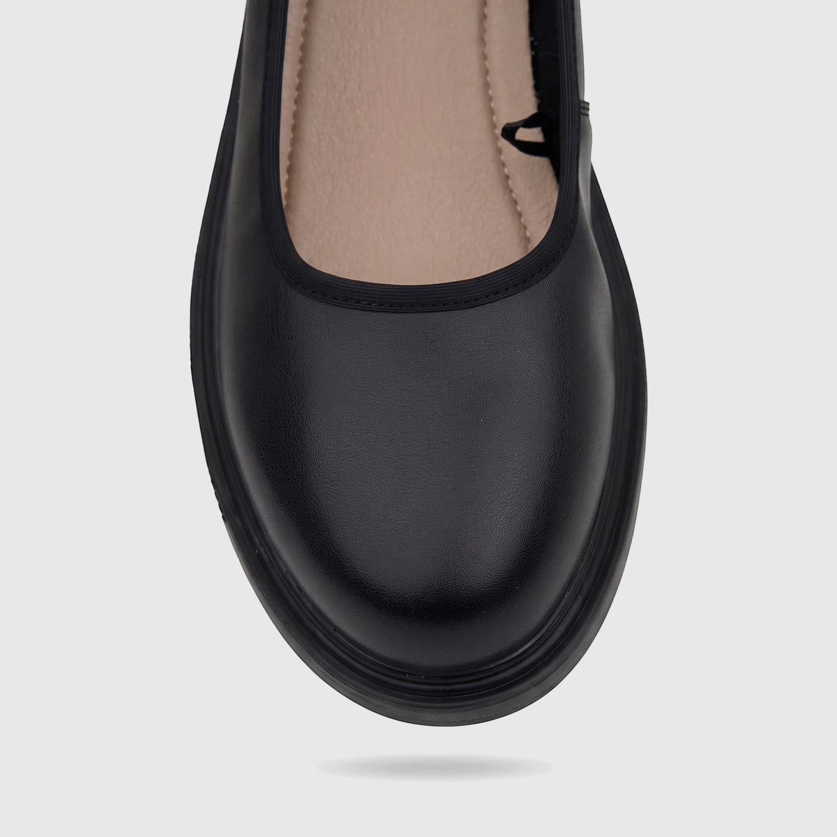 Close-up of a single Hush Puppies Valonia black comfort pump for ladies, featuring a rounded toe and textured finish.