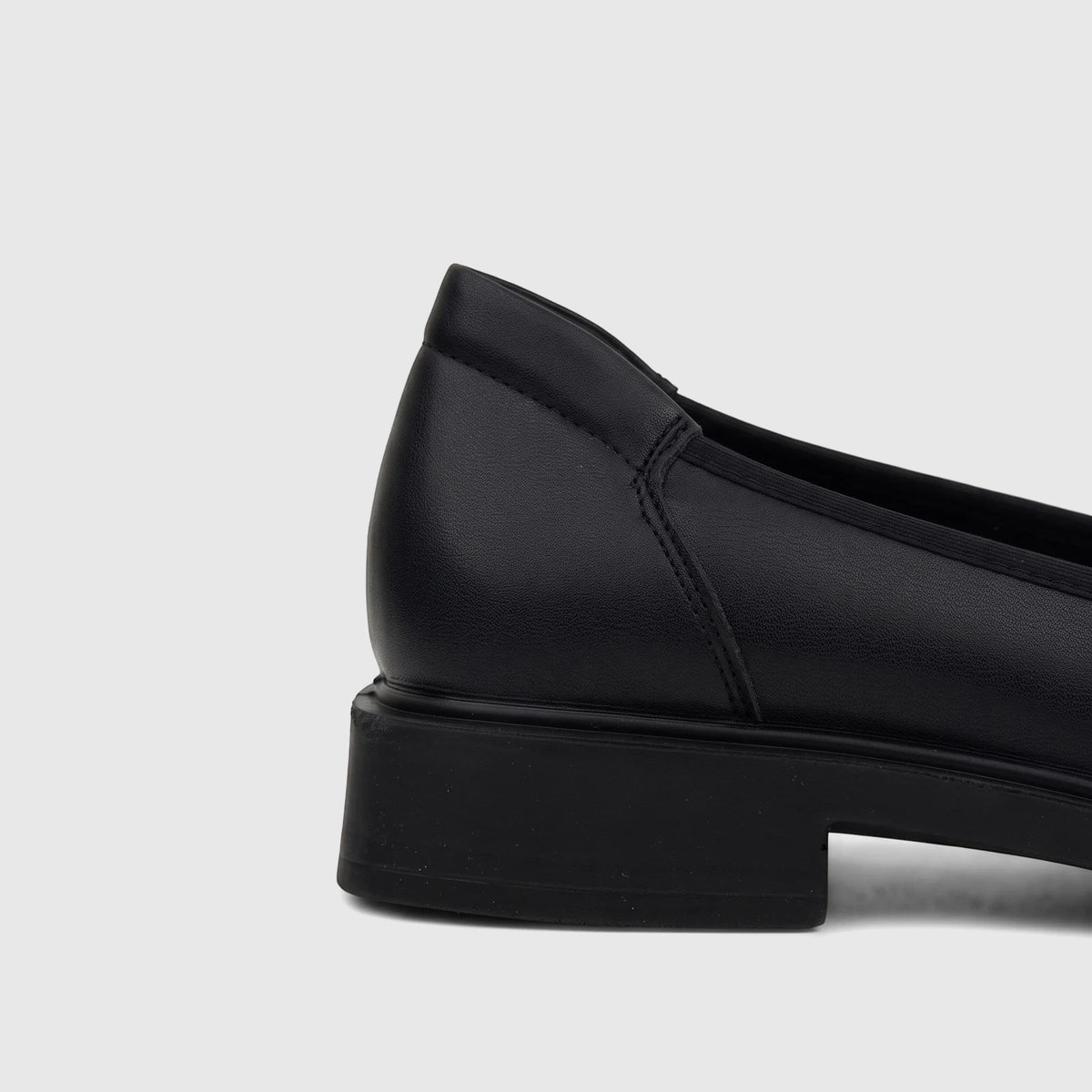 Hush Puppies Valonia black leather comfort pump for ladies, showing the heel and side view on a white background.