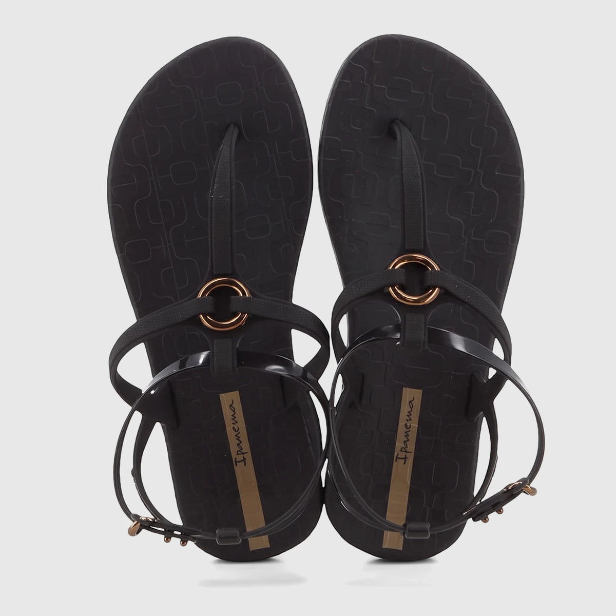 A pair of Ipanema Atena black rubber sandals with thong-straps and gold metallic ring detail for women.