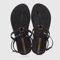 A pair of Ipanema Atena black rubber sandals with thong-straps and gold metallic ring detail for women.