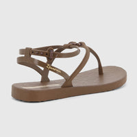 Brown Ipanema Atena sandals with thin straps and an adjustable ankle buckle, featuring a thong toe post, shown in an angled