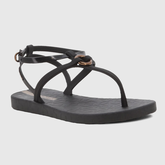 Black Ipanema Atena thong sandal with ankle strap and a gold-tone buckle, viewed from the side on a white background.