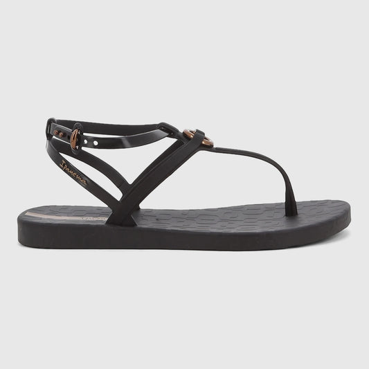 Black Ipanema Atena thong sandal with ankle strap and a gold-tone buckle, viewed from the side on a white background.