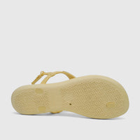 Yellow gold Ipanema Class Daring Sandal, shown from the underside, highlighting the textured sole and brand details.