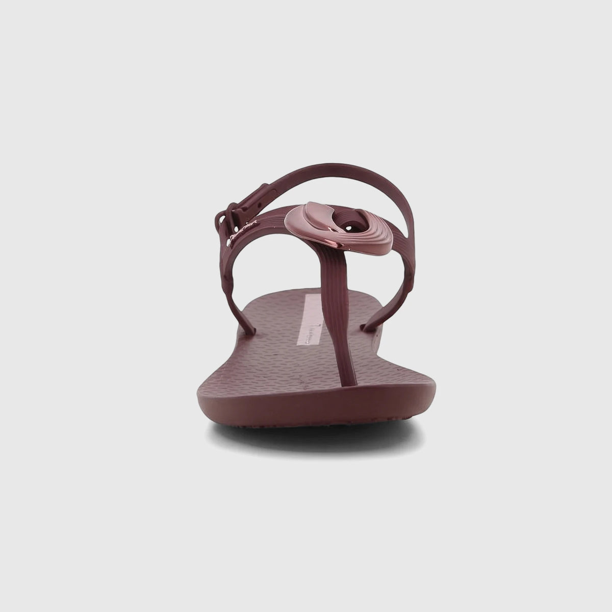 Ipanema Class Dreamy Sandal in burgundy with a decorative buckle, thong strap, and adjustable ankle strap, front view.