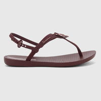 Burgundy Ipanema Class Dreamy thong sandal with an adjustable ankle strap and a metallic detail on the front, viewed from