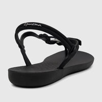 Black Ipanema Class Lizz women's sandal with a white logo and adjustable ankle strap, showcased from a back-right view.