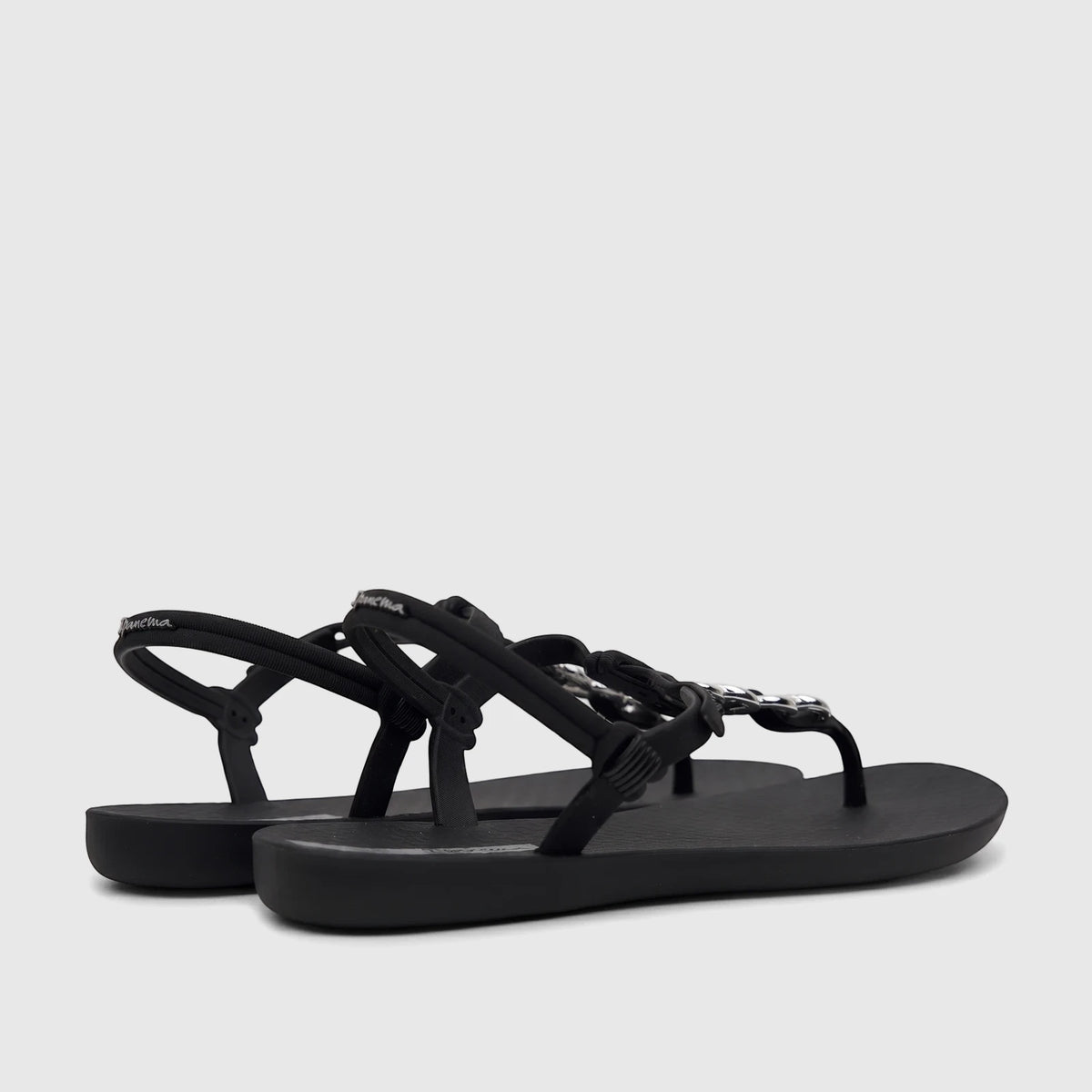 Pair of Ipanema Class Lizz sandals in black with silver chain embellishments on the T-strap, presented in a side view.