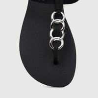 Close-up of an Ipanema Class Lizz Sandal in black with silver chain links on the strap, visible from the toe to mid-foot.