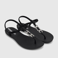 A pair of black Ipanema Class Lizz sandals with silver chain-link details and an adjustable ankle strap, viewed from an