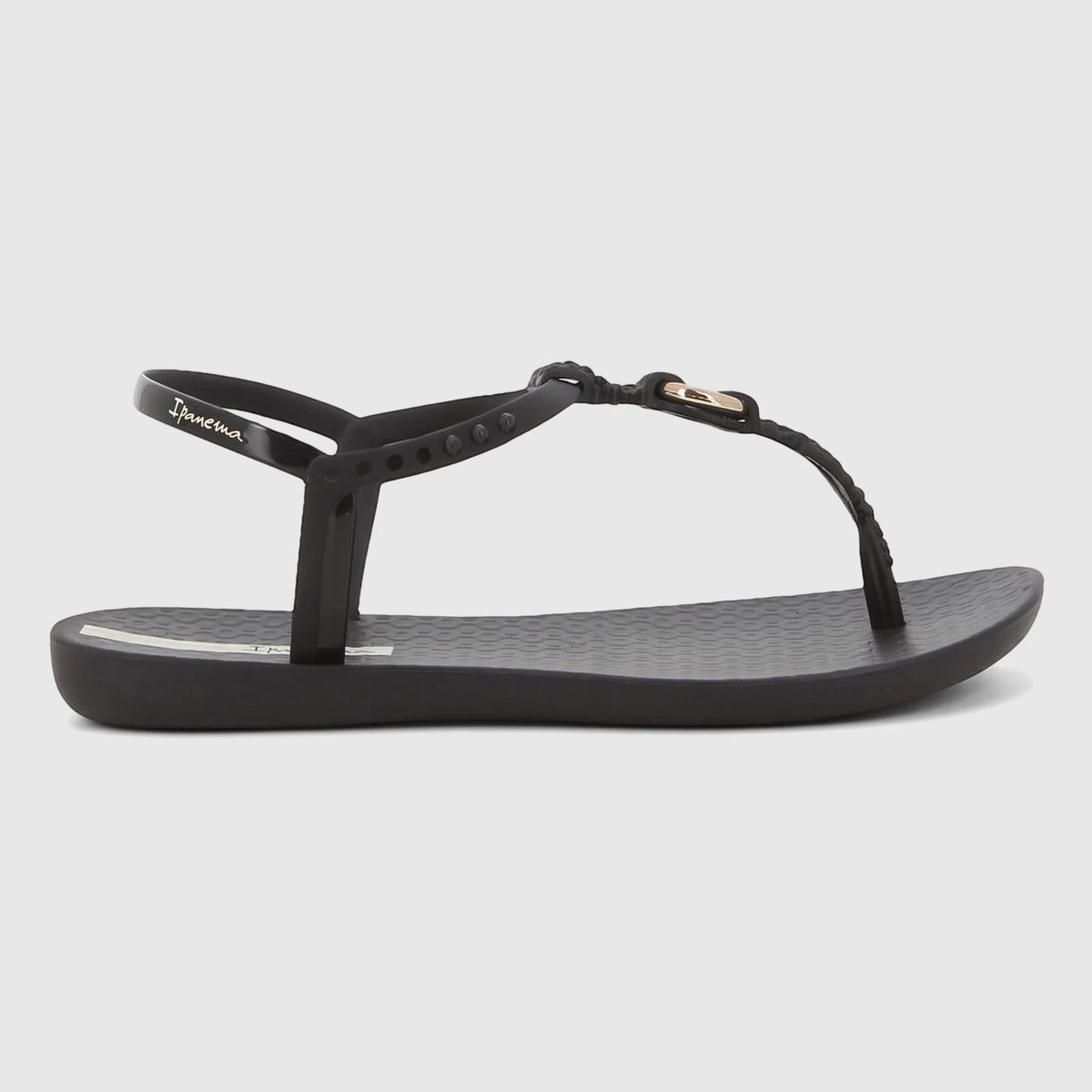 Black Ipanema Class Luma thong sandals with gold detail, featuring a textured sole, shown from a side view.