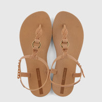 Pair of Ipanema Class Luma women's sandals in beige-brown, featuring braided T-straps with gold rings and adjustable ankle