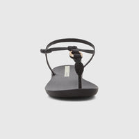 Front view of an Ipanema Class Luma women's sandal in black with a braided thong strap and gold ring detail.