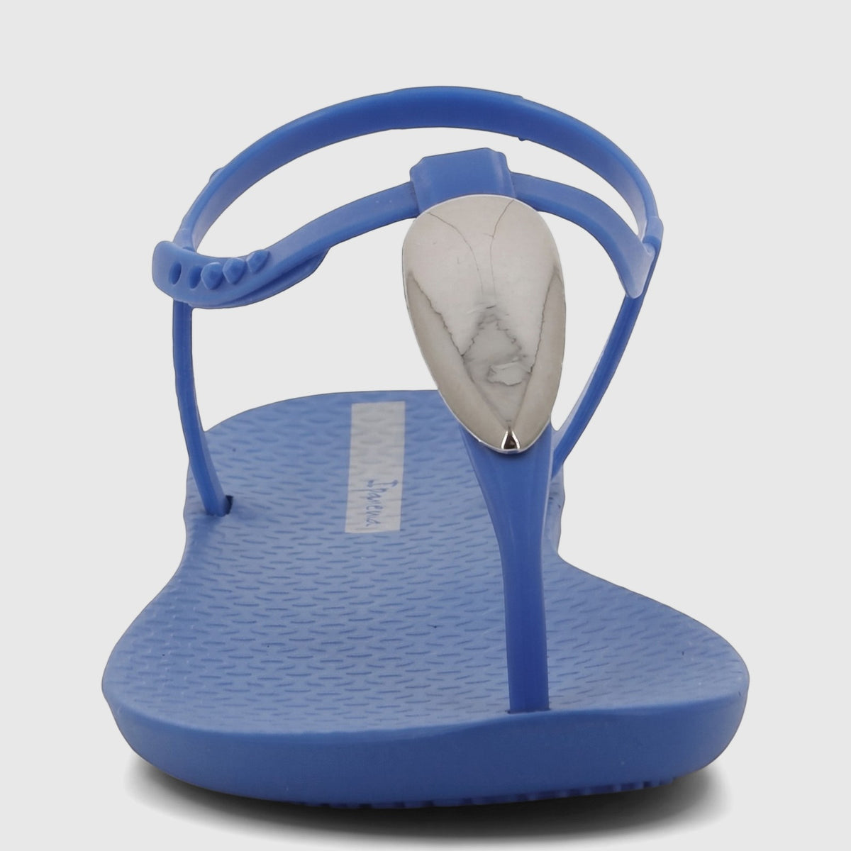Ipanema Class Luxury T-strap sandal in vibrant blue with a silver-toned, marble-patterned oval embellishment.