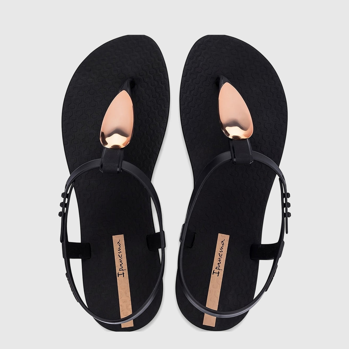 A pair of Ipanema Class Luxury GIL83954 flat sandals in black with shiny gold metallic teardrop accents, shown in a top-down