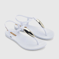 A pair of women's white Ipanema Class Luxury thong sandals featuring gold metallic accents and an adjustable ankle strap.