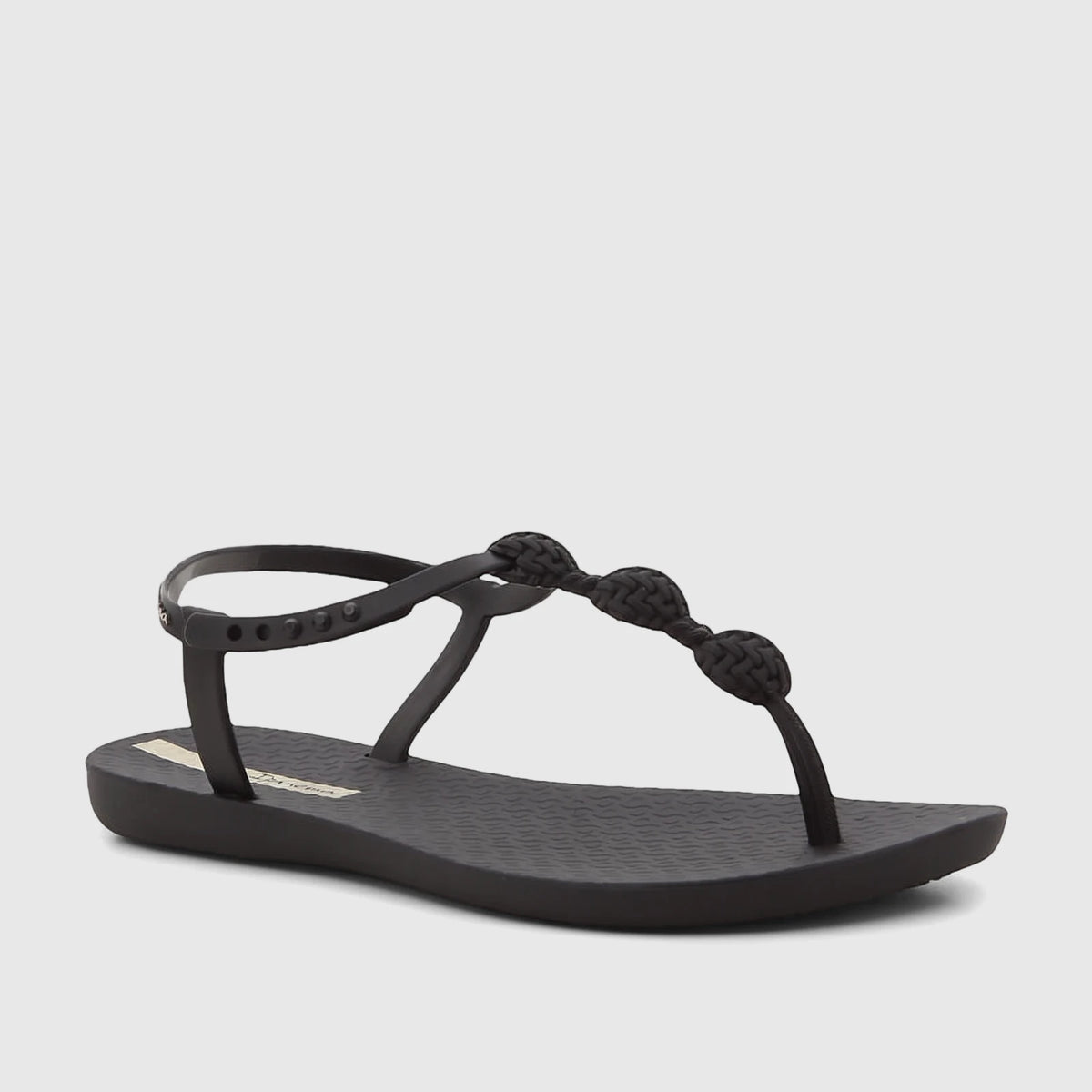 Ipanema Class Posh women's black rubber T-strap flat sandals with braided details and an ankle strap.