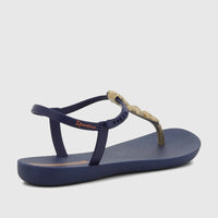 Ipanema Fundo Do Mar Sandal in blue with a gold shell-embellished strap, shown from a side angle.