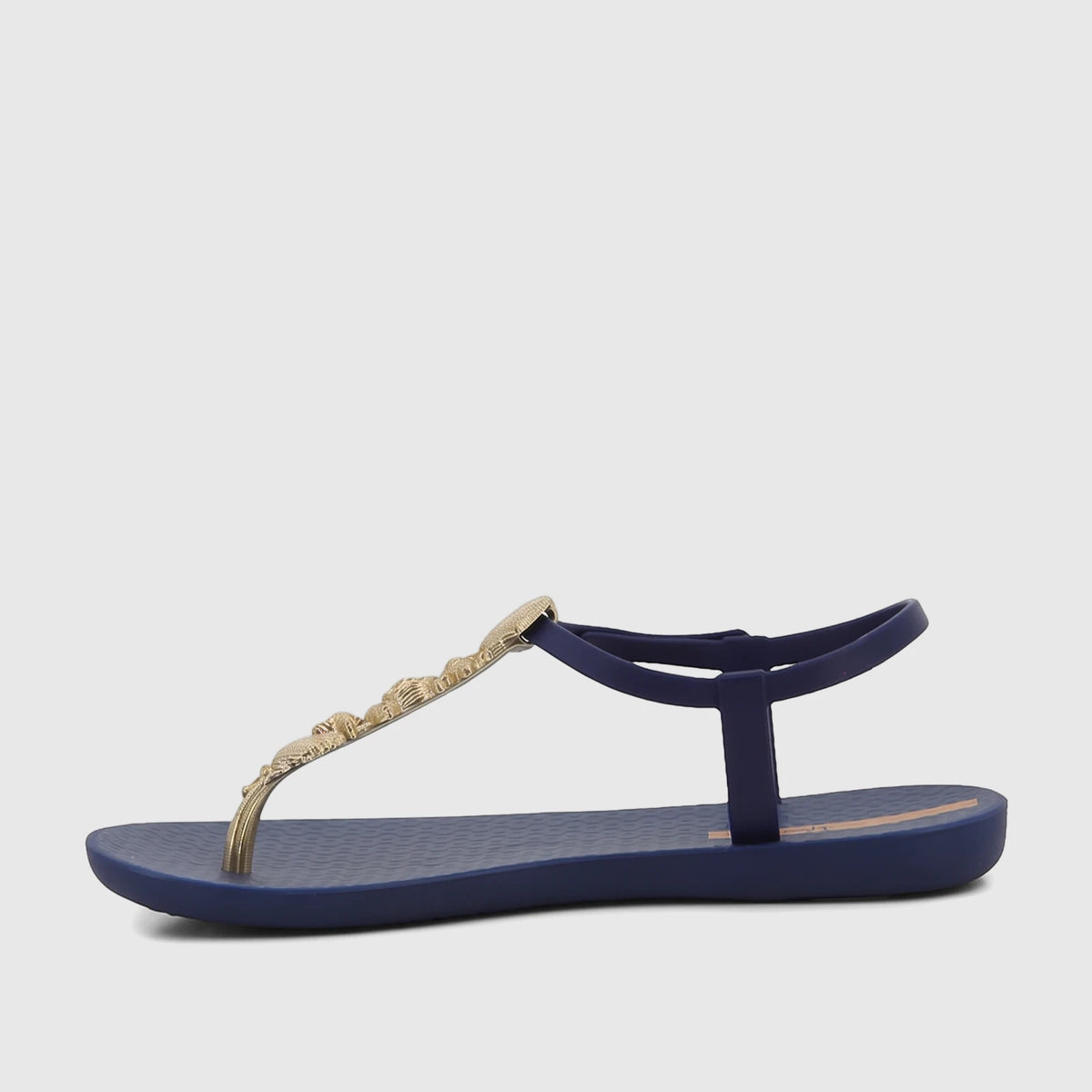 Ipanema Fundo Do Mar thong sandal in navy blue with a gold beaded shell and starfish strap, side view.