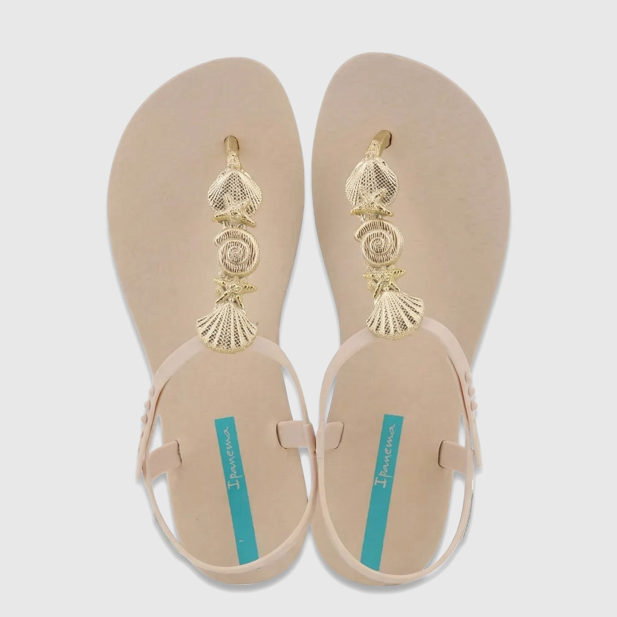 Ipanema Fundo Do Mar thong sandals in beige with gold seashell and starfish embellishments, photographed from an overhead