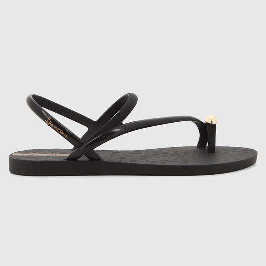 Black Ipanema Glam Ring Sandal with a gold ring detail on the toe post, showcasing its sleek design from a side profile.