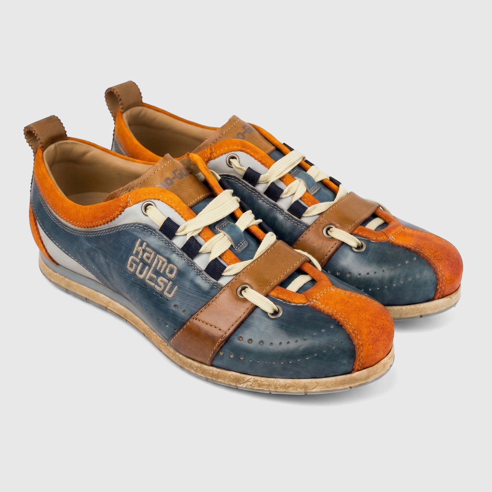 Kamo-Gutsu Men's Tifo 017 sneakers in navy, orange, and brown leather with off-white laces on a white background.