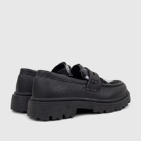 Klevas Boys black chunky sole loafers, featuring textured synthetic leather and a thick lug sole, seen from a rear-side view.
