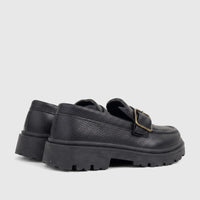 Pair of Klevas Boys black chunky sole monk strap loafers, featuring pebbled faux leather and a brass buckle.