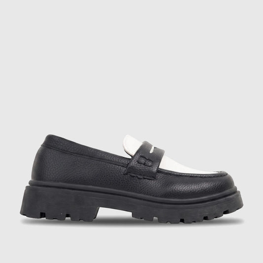 Klevas Boys black and white chunky sole loafer with textured leather upper, featuring a prominent lug sole, viewed from the