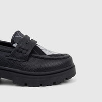 Klevas Boys black chunky sole loafer, featuring a textured upper and a black and white argyle pattern on the vamp.