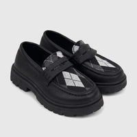 Pair of black Klevas Boys chunky sole loafers with white and gray argyle pattern detail on a white background.