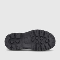 Bottom view of a black Klevas Boys chunky sole loafer, showcasing the deep tread pattern and robust design.
