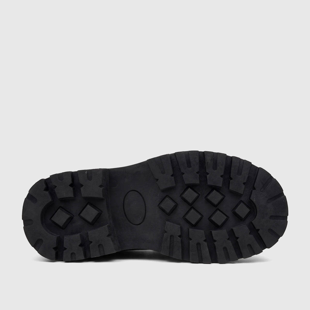 Close-up view of a Klevas Boys chunky sole loafer, featuring a black lug pattern on a robust rubber sole.
