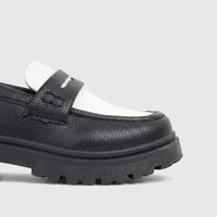 Close-up of a black and white Klevas Boys chunky sole loafer, showcasing the textured upper and prominent lug sole.