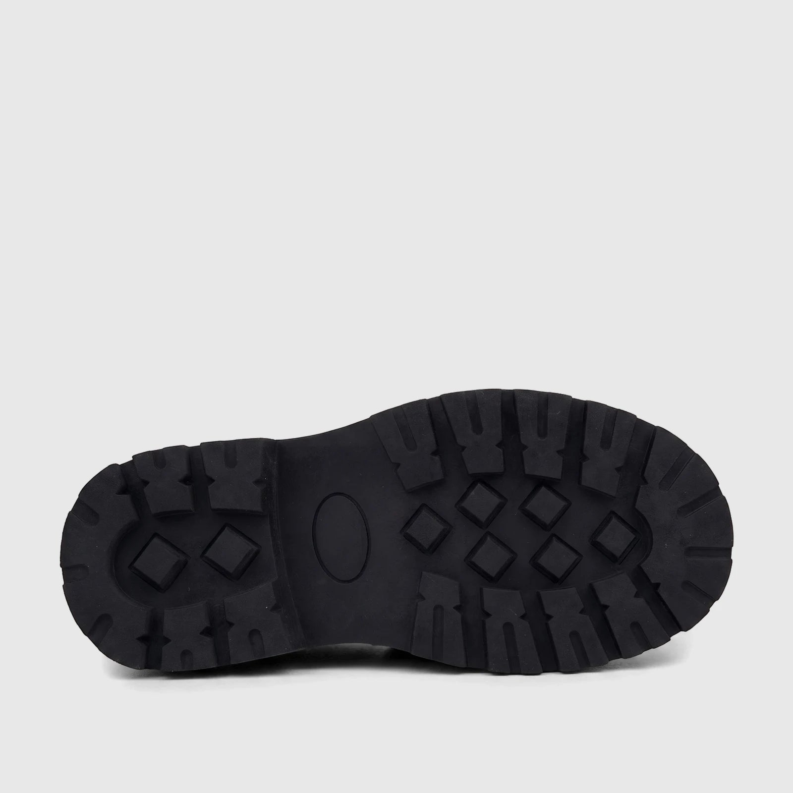 Bottom view of a black Klevas Boys chunky sole loafer, featuring deep, rugged treads and an oval design.