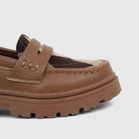 Close-up of Klevas Boys' chunky sole loafer in bowling tan, featuring a brown leather upper and argyle pattern.