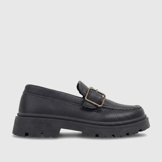 Black Klevas Boys chunky sole loafer with a monk strap buckle, featuring a pebbled texture, viewed from the side.