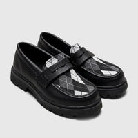 Pair of Klevas Boys Youth chunky sole loafers in black pebbled leather with a black and white argyle pattern on the vamp,