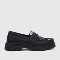 A side view of a Klevas black chunky sole loafer for boys, featuring a textured upper and a black and white argyle pattern