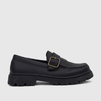 Black Klevas Youth chunky sole loafer, made from textured material, featuring a decorative buckle on the vamp and a thick