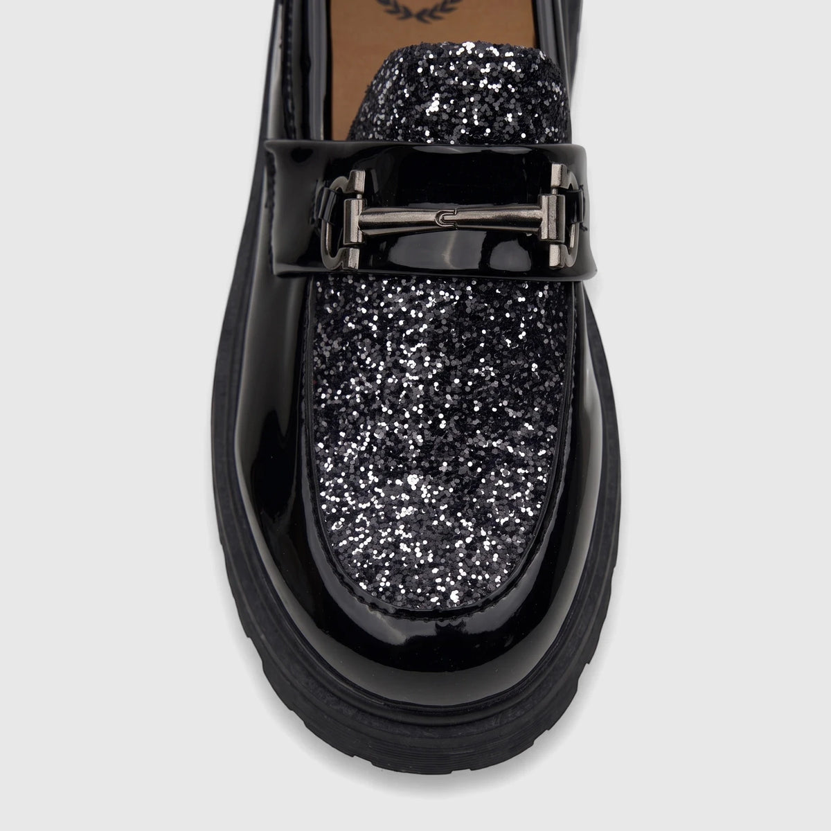 A close-up of a Klevas Boys Youth chunky sole loafer in casino black patent leather with sparkling glitter detail and a